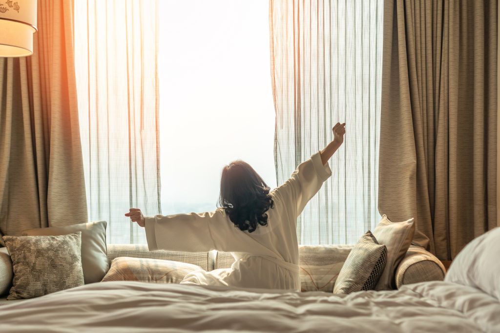 Woman sitting on a bed