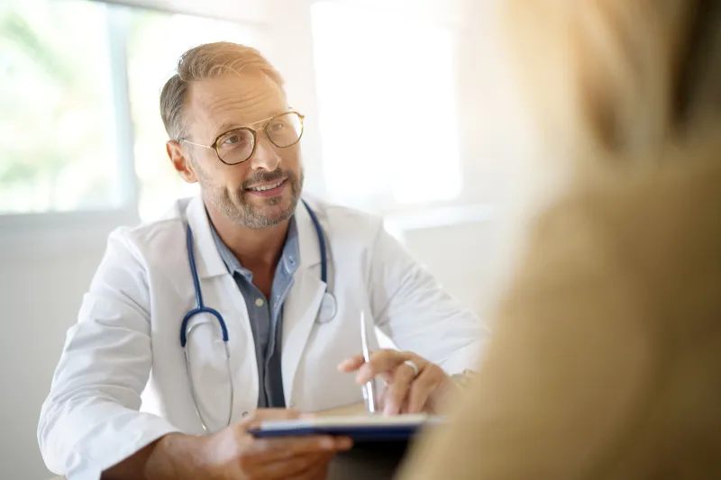 Healthcare professional talking with a patient