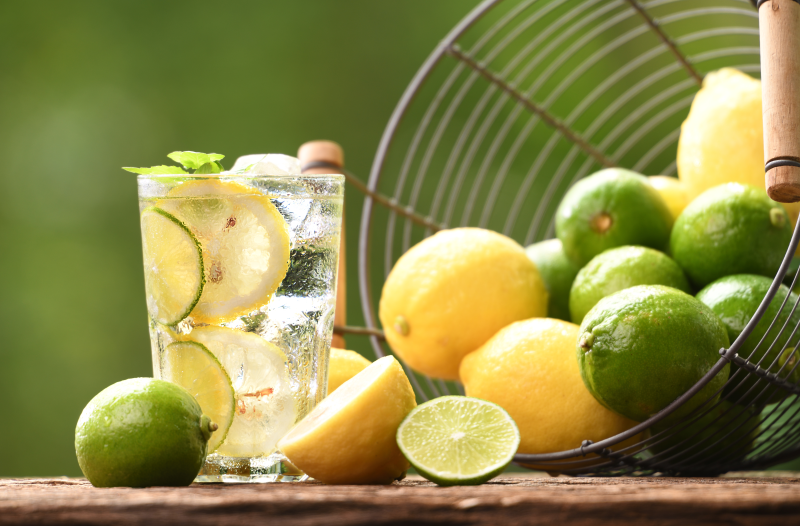 Glass with lemon and lime-infused water