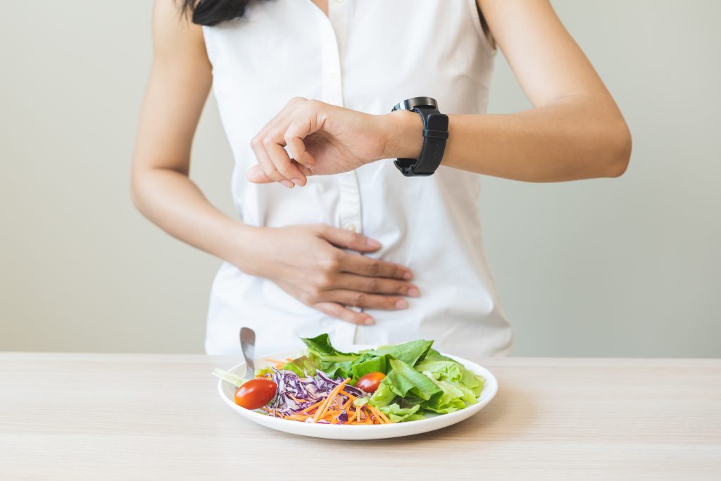 Fasting woman checking watch