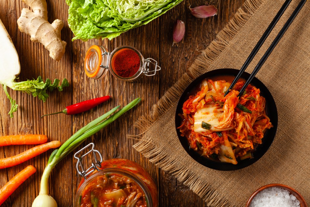 Eating fresh kimchi with chopsticks