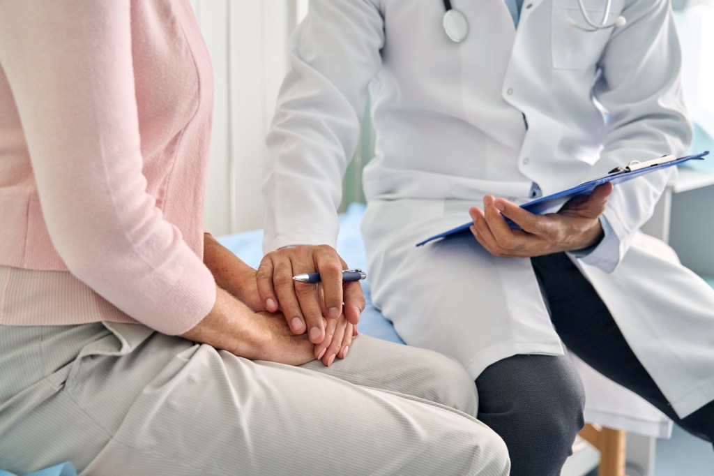 Woman talking to doctor