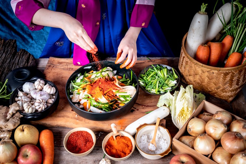 Woman preparing traditional kimchi