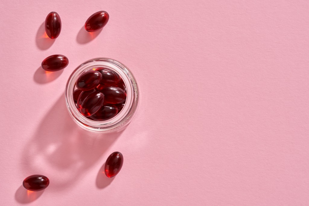 Krill oil capsules in a glass jar