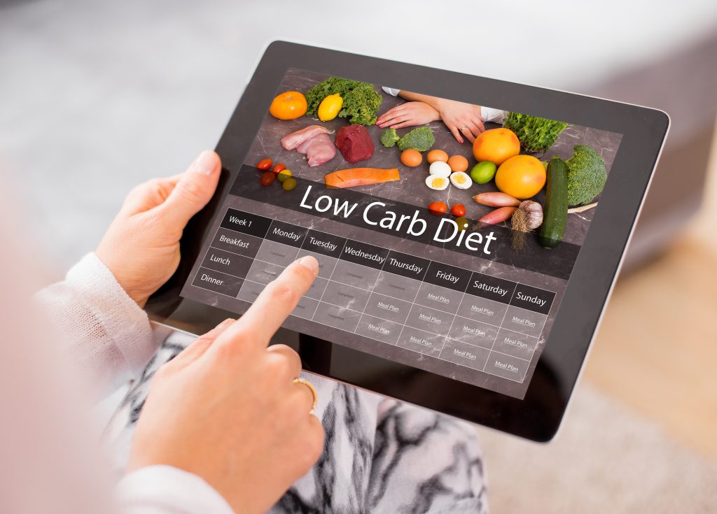 Low-carb diet concept on a tablet