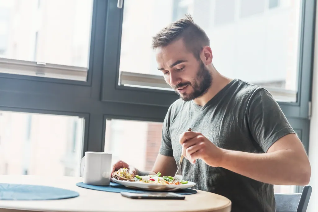 Man eating a plate of food