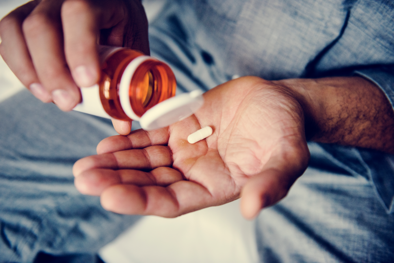 Man taking a zinc supplement