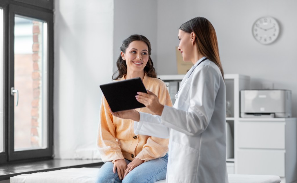 Woman talking to doctor