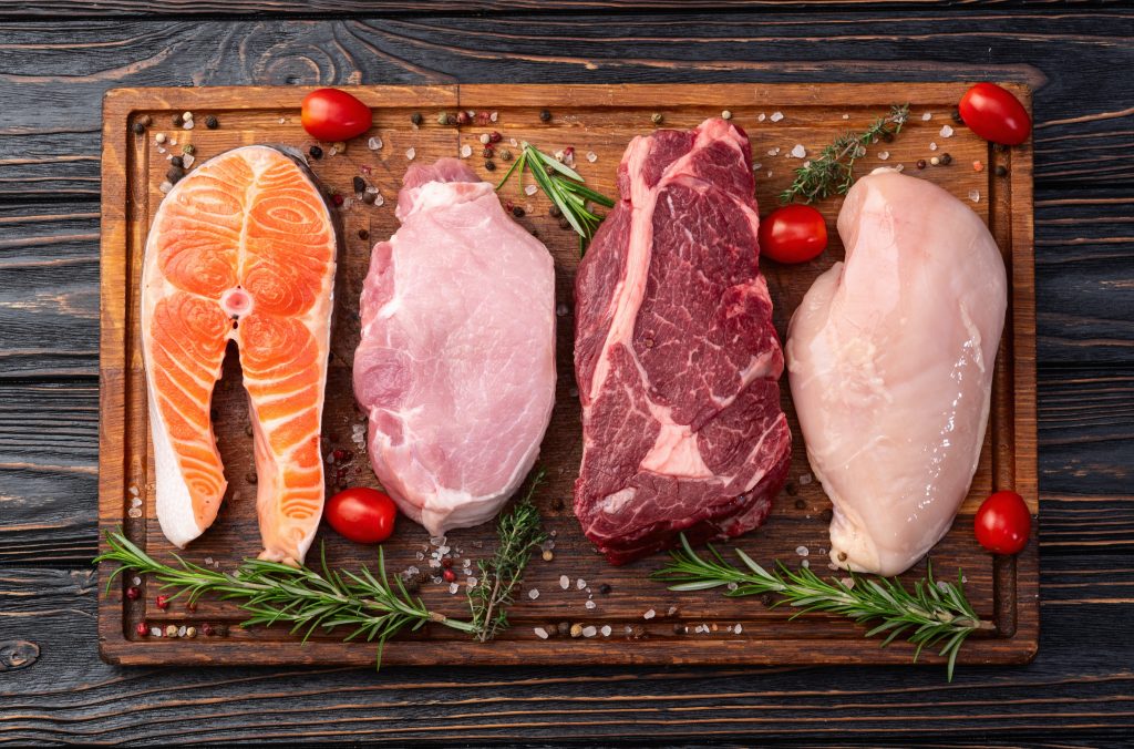 Variety of meat on cutting board 