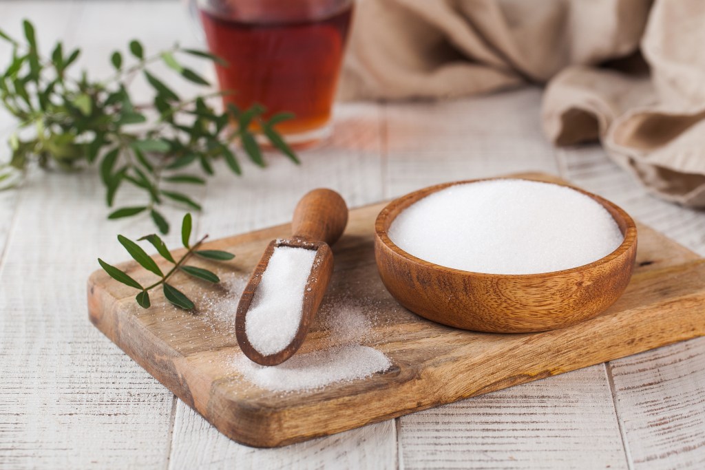 Natural sweetener on wooden spoon