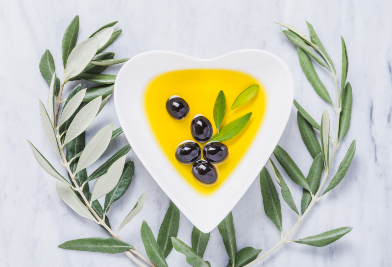 Olive oil in heart-shaped bowl