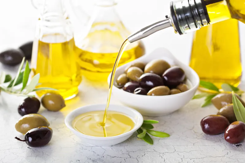 Pouring fresh olive oil