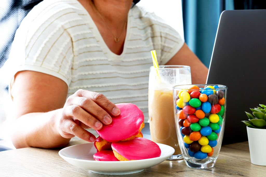 Woman eating sugary food