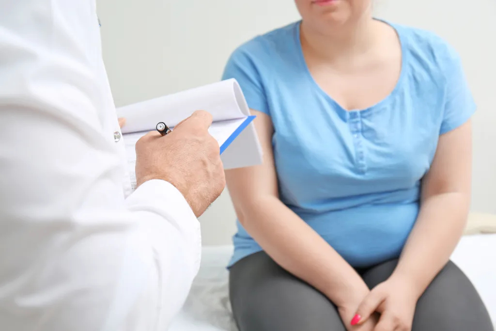 Woman talking to doctor
