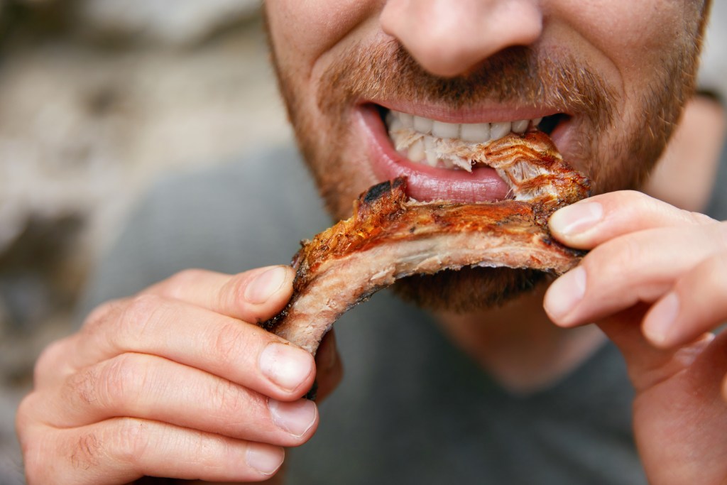Man eating meat 