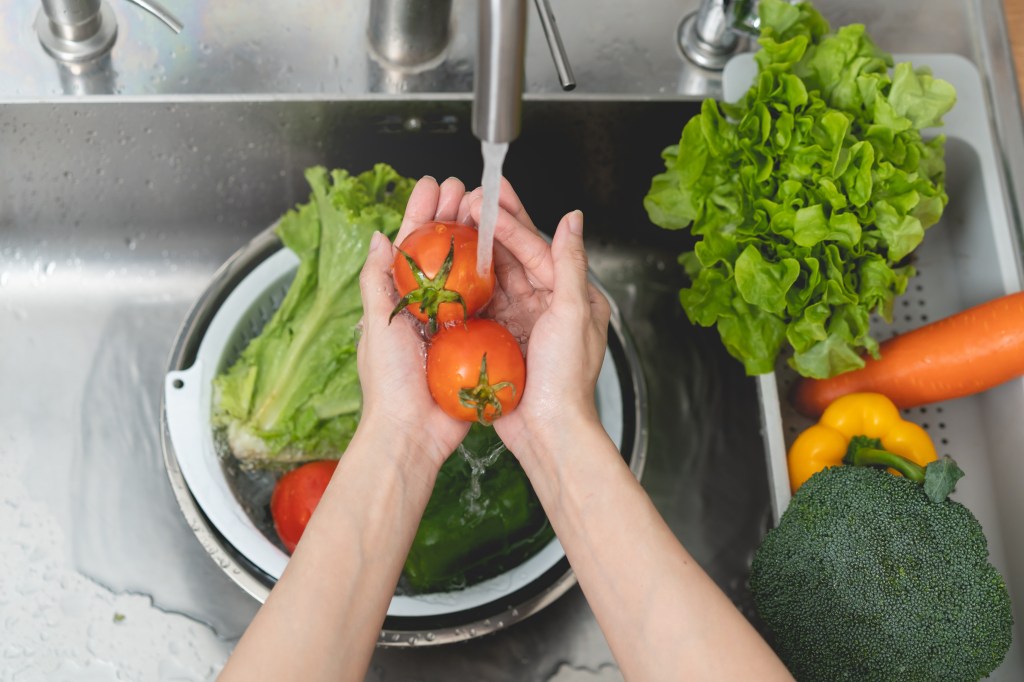 Woman washing produce