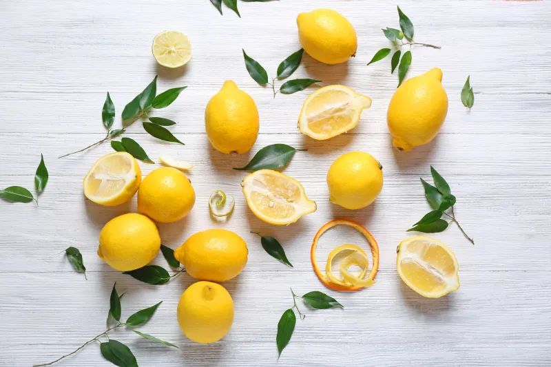 Fresh lemons on wooden table