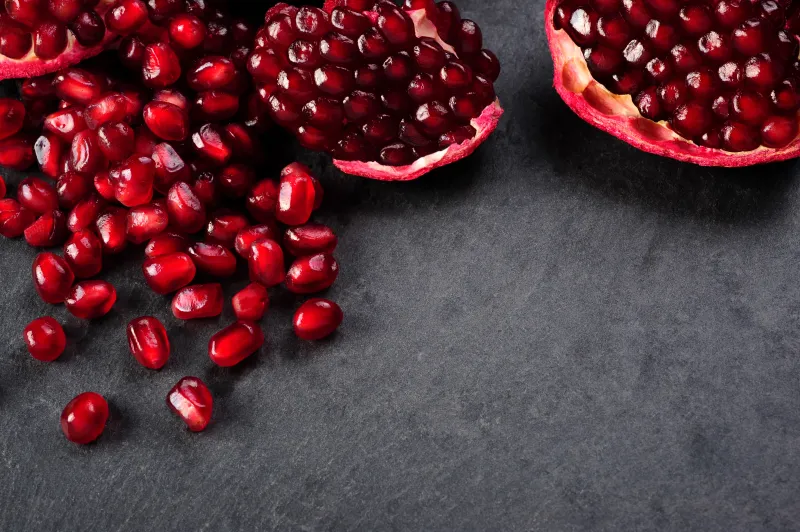 Table with pomegranate seeds