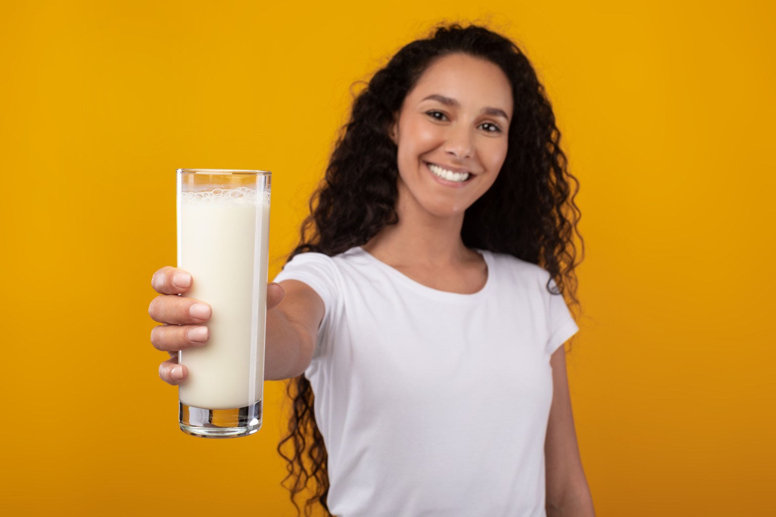 Woman holding a glass of milk
