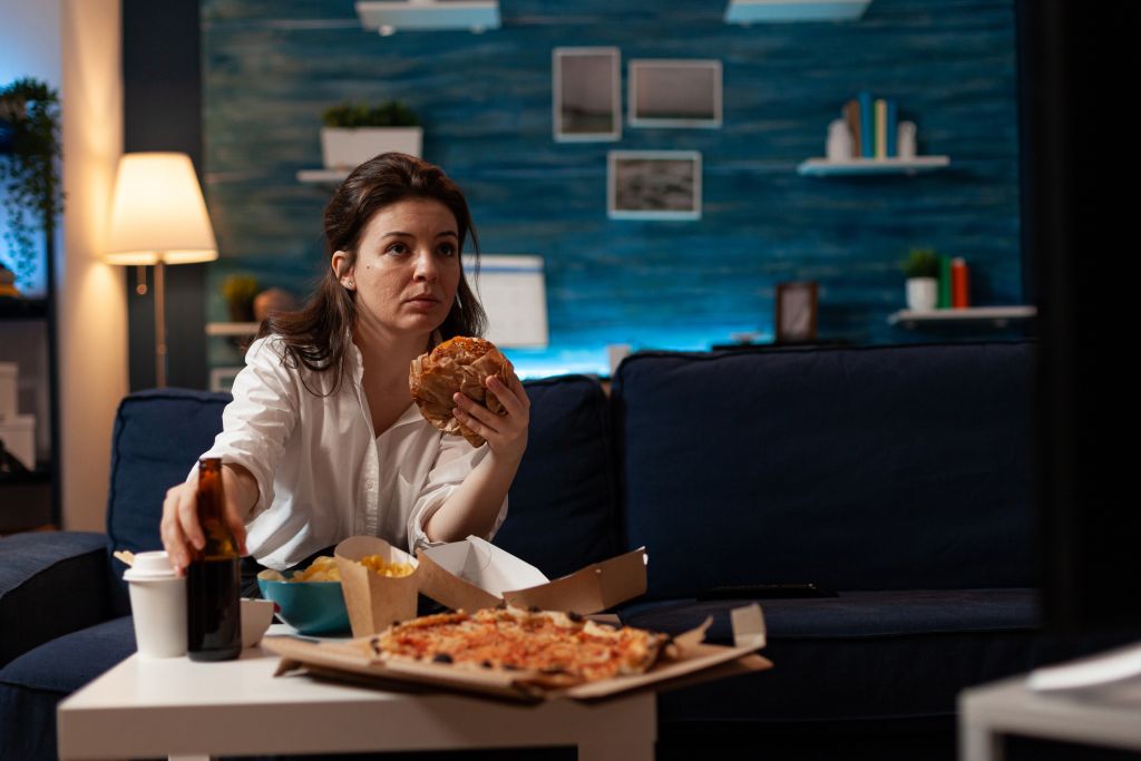 Woman eating junk food