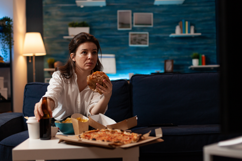 Woman eating junk food