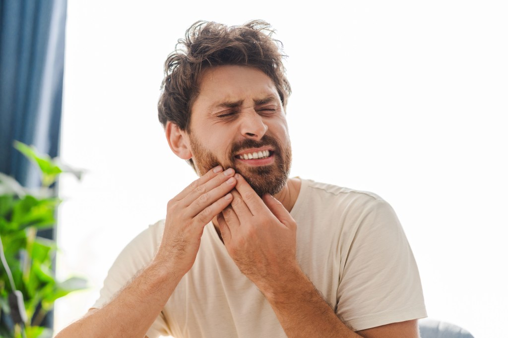 Man suffering from a toothache