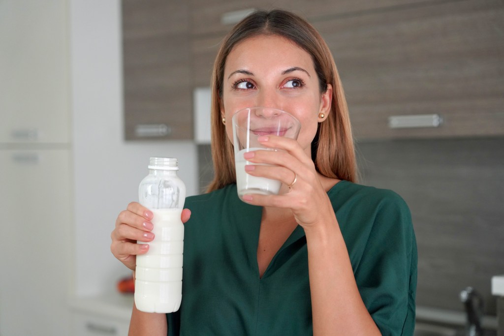 woman drinking kefir