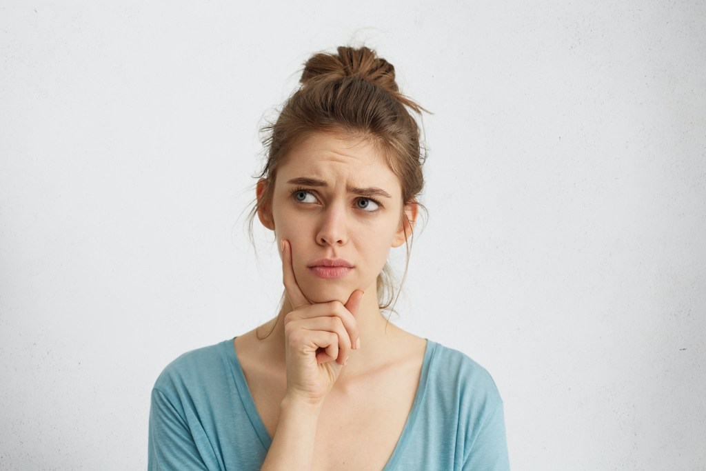 Young woman wondering