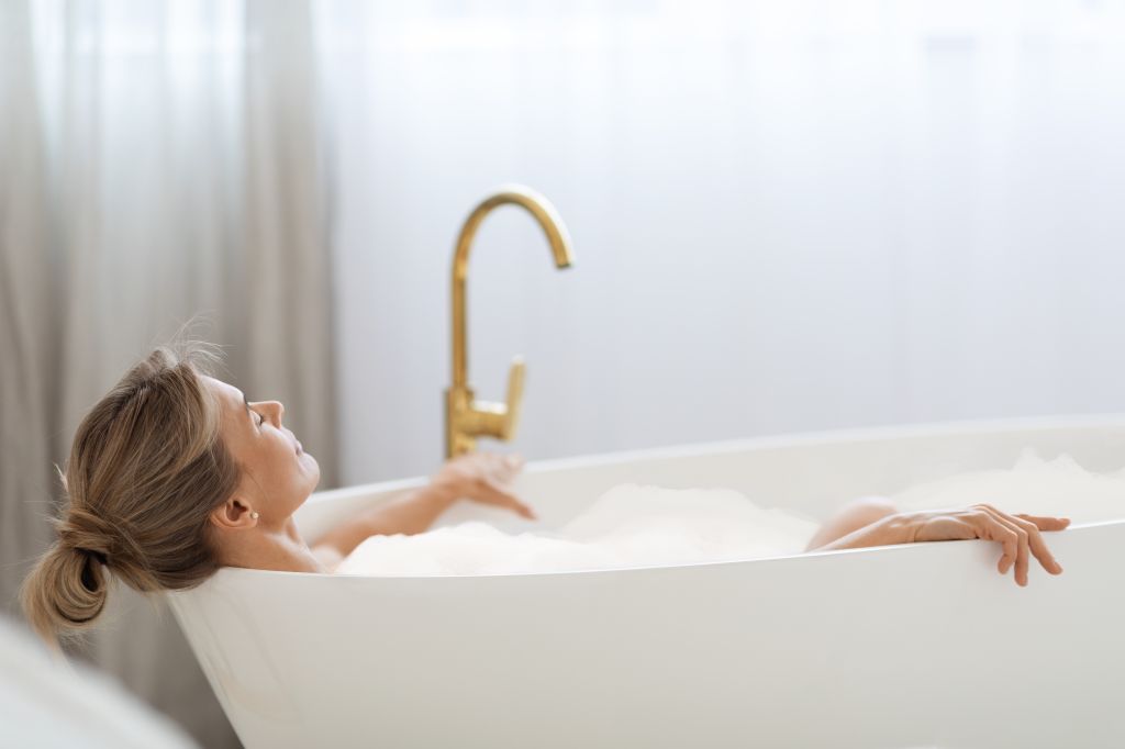 Woman soaking in a bath