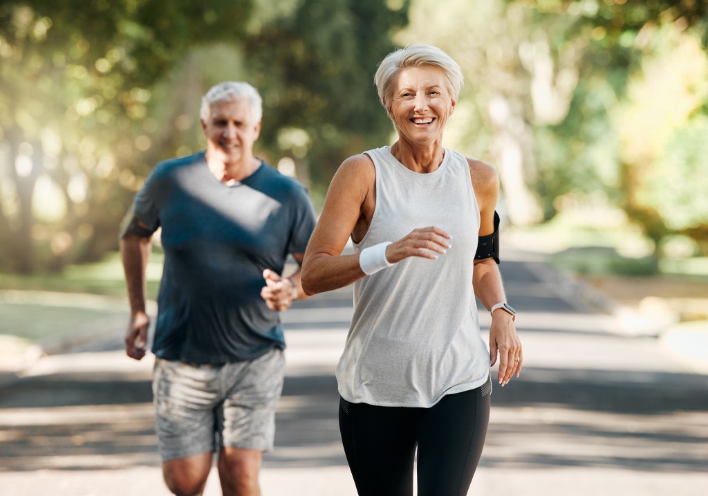 Older couple running 
