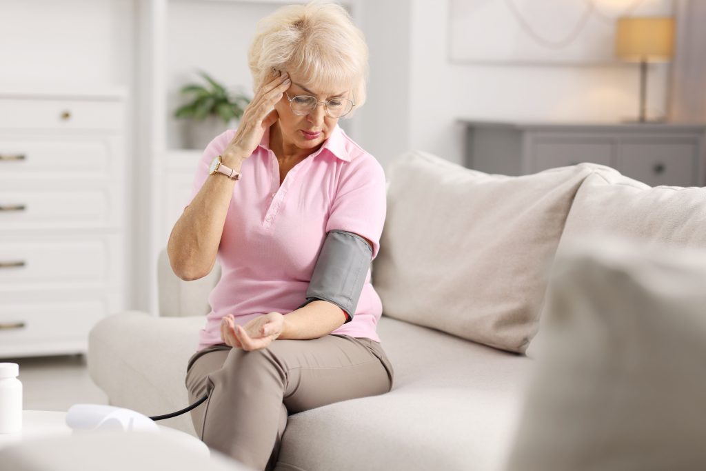 Woman measuring blood pressure   