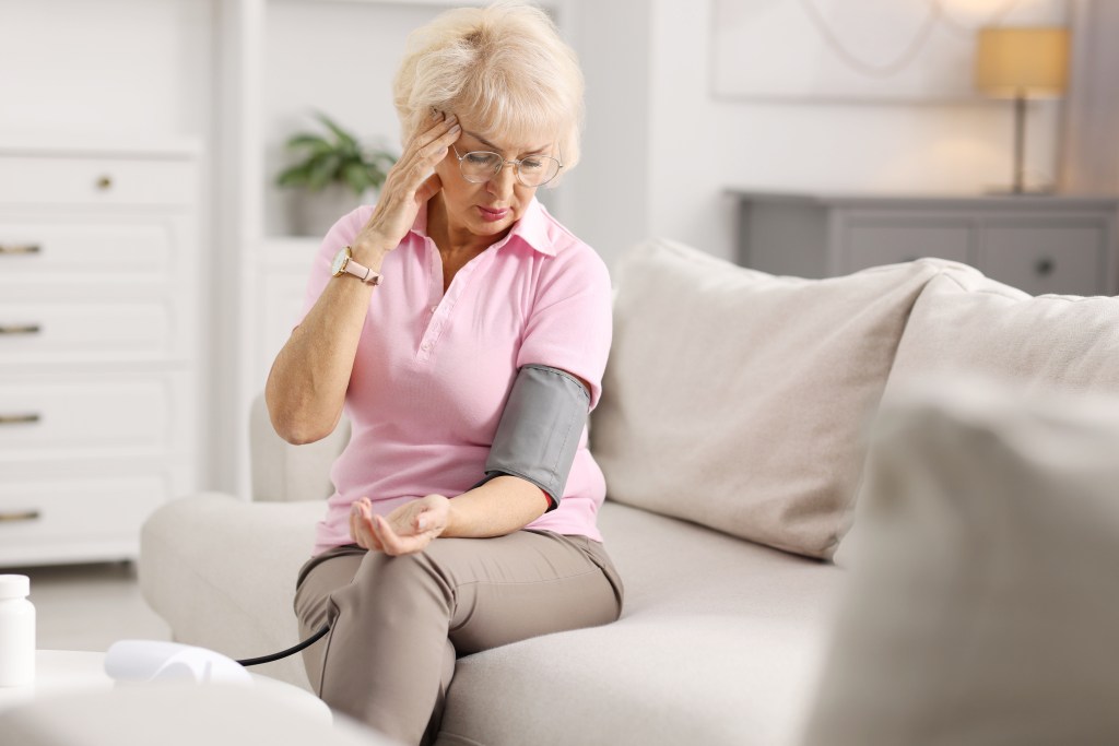 Woman measuring blood pressure