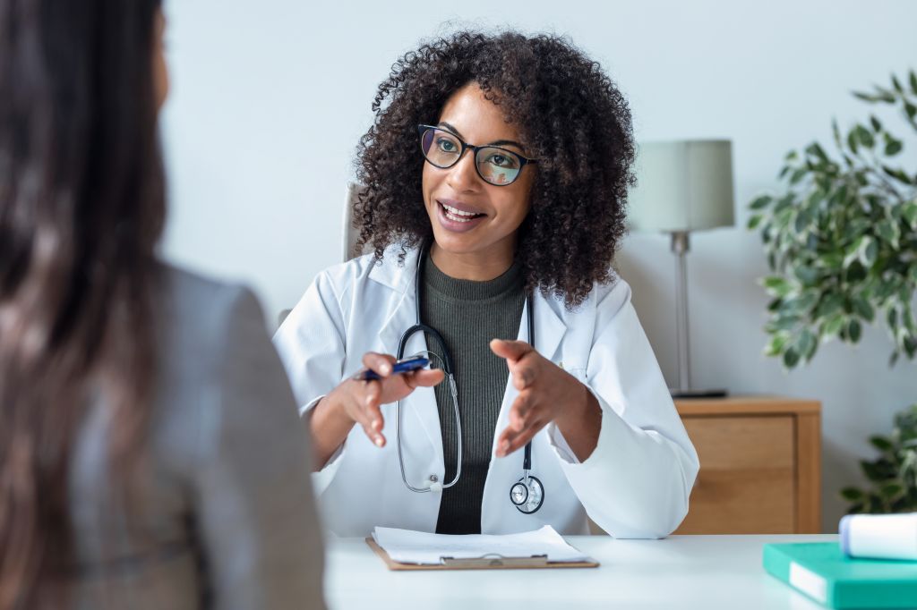 Woman talking to doctor