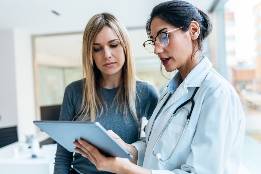 Woman speaking to doctor