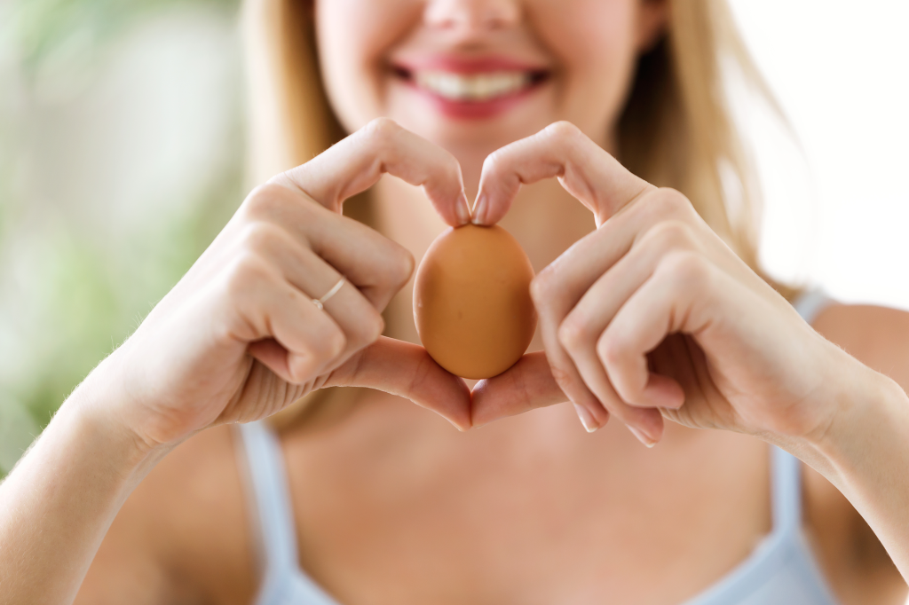 Woman with brown egg