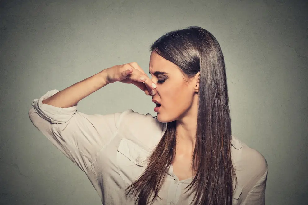 Woman pinching her nose