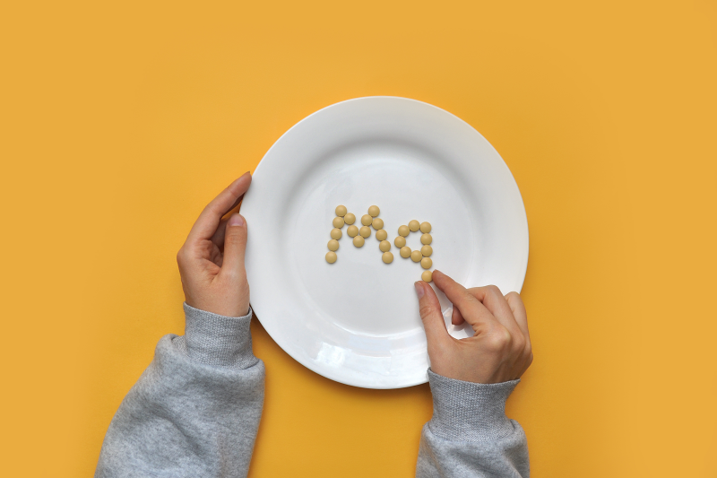 Magnesium supplements on a dinner plate