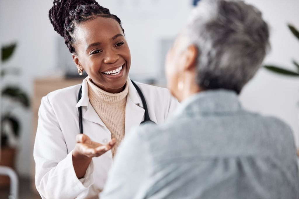 Woman talking to doctor