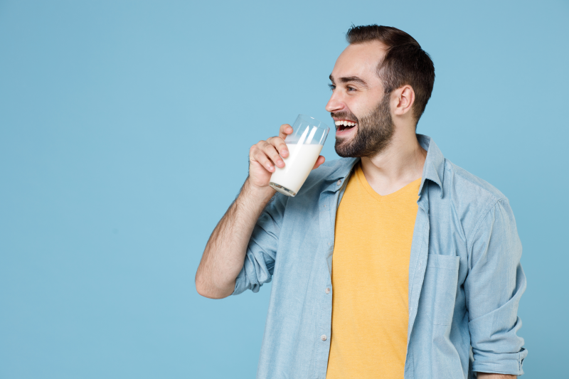 Happy man drinking milk