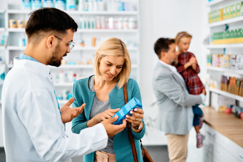 Pharmacist helping patients