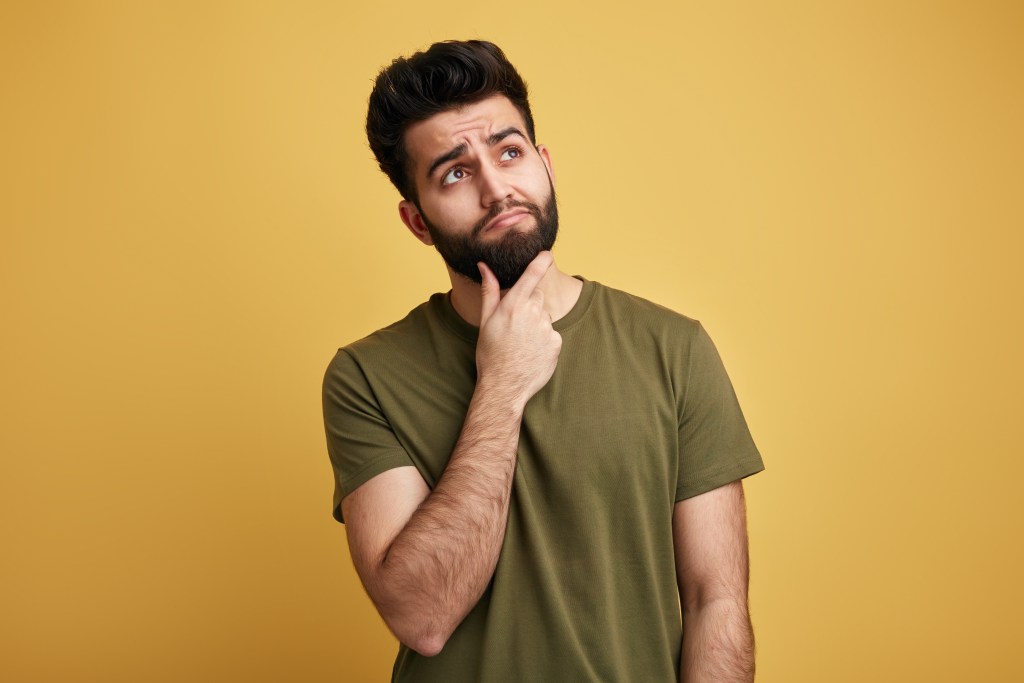 Young man wondering