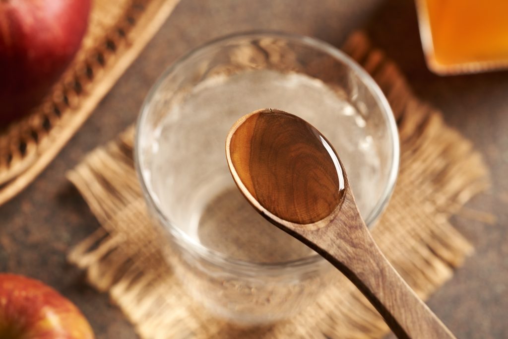 Spoon full of apple cider vinegar