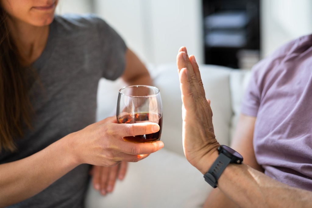 Refusing glass of alcohol