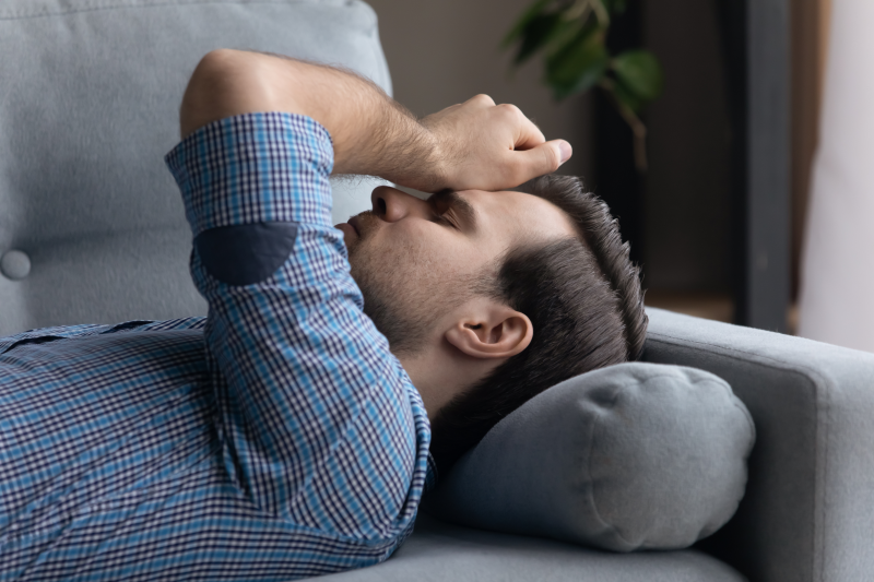 Tired man on a sofa