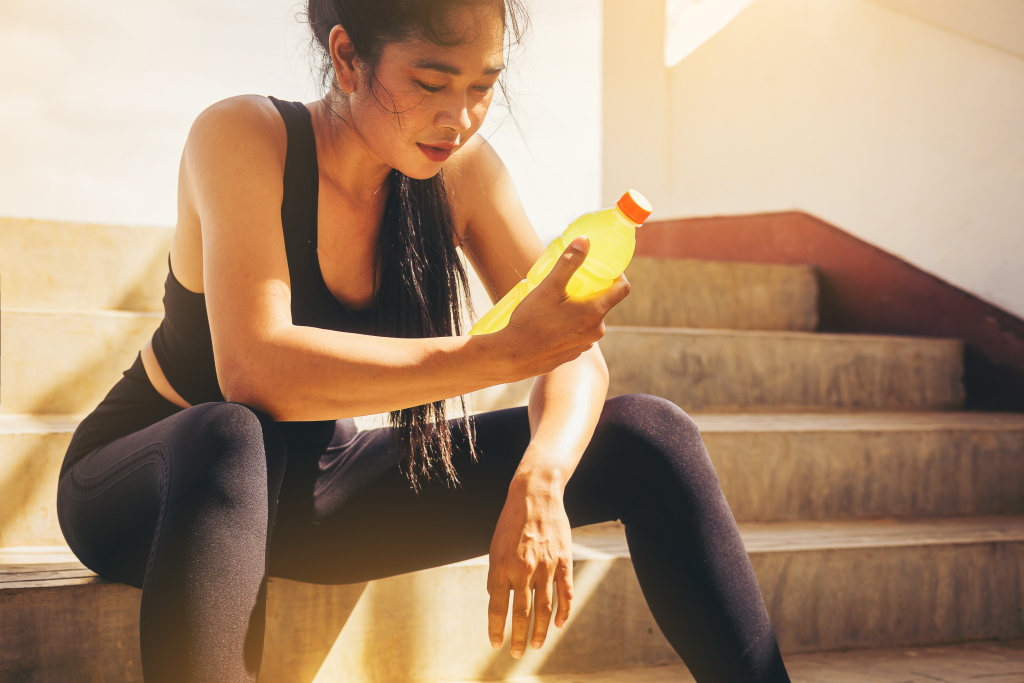Woman holding a sports drink