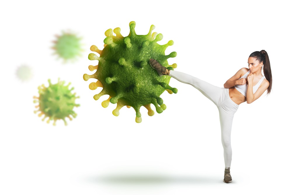 Woman kicking a virus 
