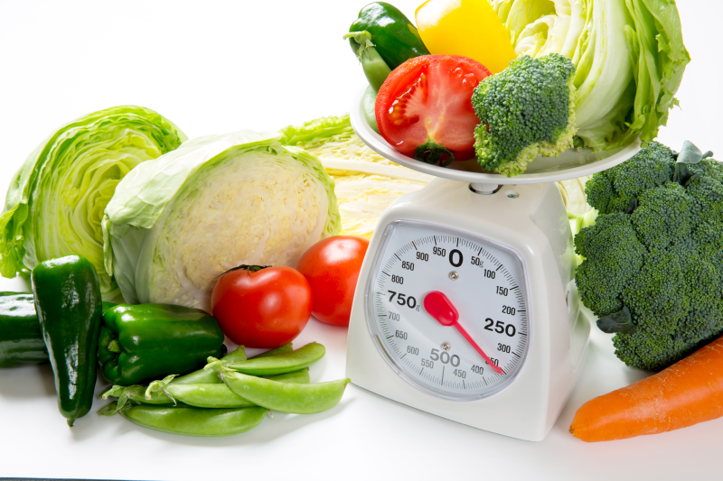 Weighing vegetables on a scale