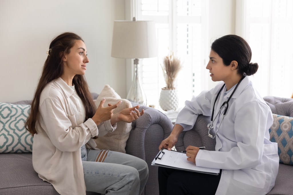 Woman talking to doctor