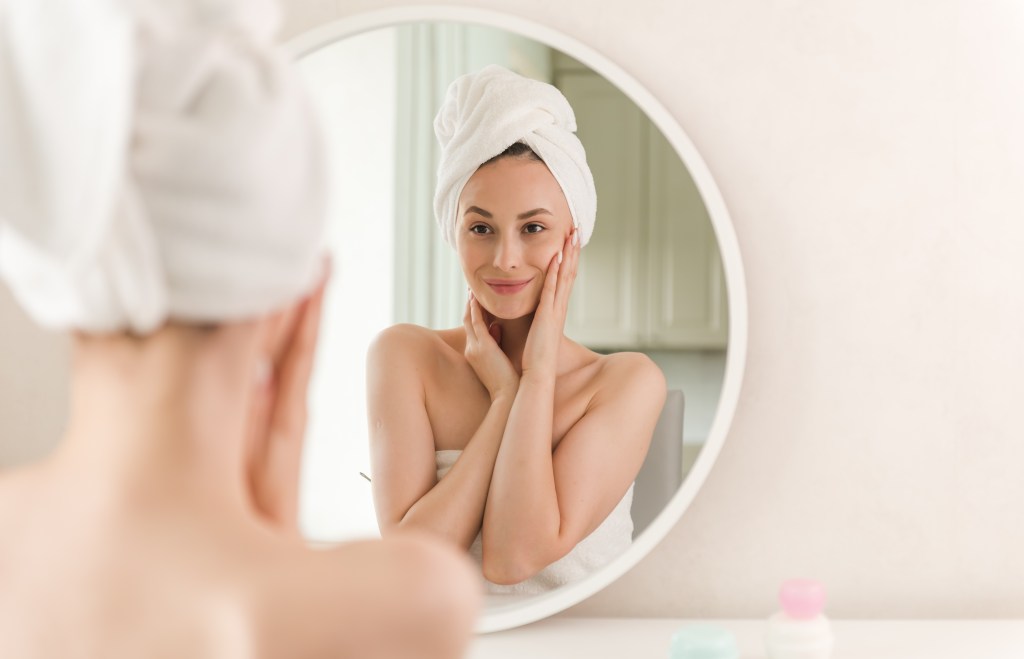 Appreciating healthy skin in the mirror 