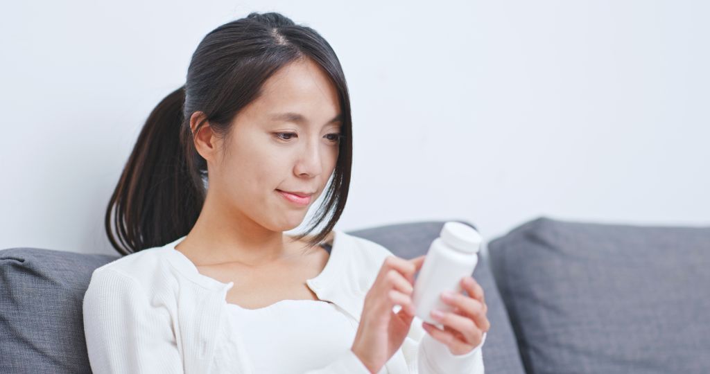 Woman reading label